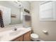 Clean bathroom with a vanity, mirror, and a window for natural light at 1568 Brookfield Cir, Franklin, IN 46131