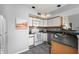 Functional kitchen featuring white appliances, ample cabinet space, and a convenient breakfast bar at 1568 Brookfield Cir, Franklin, IN 46131