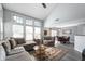 Bright living room with soaring ceilings, large windows, and stylish furniture and décor at 1568 Brookfield Cir, Franklin, IN 46131