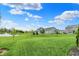 Expansive green lawn overlooks a serene pond, enhancing the backyard's appeal at 15752 Matthews Ln, Noblesville, IN 46060