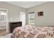 This cozy bedroom features carpet flooring, a window with view, and a 3-drawer dresser at 15752 Matthews Ln, Noblesville, IN 46060