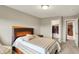 Bedroom with light grey walls, neutral carpet, bed, walk-in closet, and connecting room at 15752 Matthews Ln, Noblesville, IN 46060