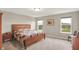 Comfortable bedroom with large bed, bedside table, and views of the backyard, creating a relaxing retreat at 15752 Matthews Ln, Noblesville, IN 46060