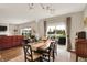 Open concept dining area with a view of the water, wood floors, and plenty of natural light at 15752 Matthews Ln, Noblesville, IN 46060