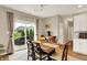 Charming dining area with a sliding glass door leading to the backyard and lots of natural light at 15752 Matthews Ln, Noblesville, IN 46060