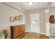 Inviting entryway with wood floors, white trim, and decorative accents at 15752 Matthews Ln, Noblesville, IN 46060