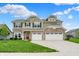 Beautiful two-story home with a stone facade and a three-car garage at 15752 Matthews Ln, Noblesville, IN 46060