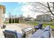 A backyard patio features comfortable seating and a basketball hoop in a well-maintained outdoor space at 15898 Bounds Dr, Noblesville, IN 46062
