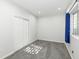Minimalist basement bedroom showcasing neutral carpet, a closet, and a window for natural light at 15898 Bounds Dr, Noblesville, IN 46062