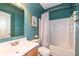 Bathroom with sink, mirror, bathtub with shower and blue walls at 15898 Bounds Dr, Noblesville, IN 46062