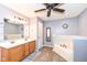 Bright bathroom with a double vanity, a large mirror, and a separate bathtub at 15898 Bounds Dr, Noblesville, IN 46062