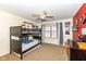 ' bedroom with a bunk bed, ceiling fan and window providing natural light at 15898 Bounds Dr, Noblesville, IN 46062