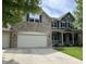 Beautiful two-story home with stone accents, a covered porch, and a spacious attached two car garage at 15898 Bounds Dr, Noblesville, IN 46062