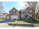 Charming two-story home with stone facade, well-manicured lawn, and a convenient three-car garage at 15898 Bounds Dr, Noblesville, IN 46062