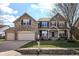 Charming two-story home with stone facade, well-manicured lawn, and a convenient three-car garage at 15898 Bounds Dr, Noblesville, IN 46062
