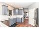 Well-lit kitchen with gray cabinets, stainless steel appliances, and granite countertops at 15898 Bounds Dr, Noblesville, IN 46062