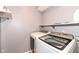 Functional laundry room with a side-by-side washer and dryer, and shelving at 15898 Bounds Dr, Noblesville, IN 46062
