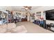 Inviting living room with a comfortable sofa, ceiling fan, and shelving for memorabilia at 15898 Bounds Dr, Noblesville, IN 46062