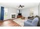 Inviting living room with fireplace, wood floors, and plenty of natural light at 15898 Bounds Dr, Noblesville, IN 46062
