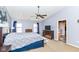 Comfortable bedroom with a ceiling fan, hardwood furniture, and two windows at 15898 Bounds Dr, Noblesville, IN 46062