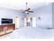 Cozy bedroom featuring a ceiling fan, hardwood furniture, and light blue walls at 15898 Bounds Dr, Noblesville, IN 46062