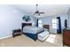 Spacious bedroom with a ceiling fan, hardwood furniture, and ample natural light at 15898 Bounds Dr, Noblesville, IN 46062