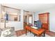 Spacious office area featuring wood floors, neutral paint, and a cozy couch at 15898 Bounds Dr, Noblesville, IN 46062