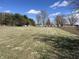 Expansive open grassy acreage with blue skies and scattered trees at 17245 N 200 E, Summitville, IN 46070