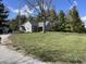 Charming single-story home featuring a well-maintained lawn, mature trees, and cozy front porch at 17245 N 200 E, Summitville, IN 46070