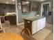 Open concept kitchen featuring stainless steel appliances, an island, and seamless flow to the living area at 17245 N 200 E, Summitville, IN 46070