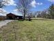 Large open outbuilding and well-maintained grassy acreage on this beautiful property at 17245 N 200 E, Summitville, IN 46070