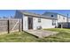 Backyard showcasing a concrete patio, fenced yard, and easy access to the home's exterior at 1850 Blue Pine Ln, Indianapolis, IN 46231