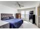 Bright bedroom featuring a ceiling fan, a bed and two dressers with natural sunlight at 1850 Blue Pine Ln, Indianapolis, IN 46231