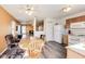 Bright dining area adjacent to the kitchen features a light fixture and hardwood floors at 1850 Blue Pine Ln, Indianapolis, IN 46231