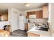 Functional kitchen with white appliances, ample counter space, and hardwood floors at 1850 Blue Pine Ln, Indianapolis, IN 46231