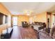 Spacious living room with hardwood floors, ample seating, and natural light at 1850 Blue Pine Ln, Indianapolis, IN 46231