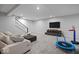 Finished basement with recreation area, carpet, and entertainment setup at 19036 Karyn Ln, Noblesville, IN 46062
