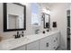 Well-lit bathroom with double vanity, modern fixtures, and stylish mirrors at 19036 Karyn Ln, Noblesville, IN 46062