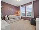 Cozy bedroom featuring a daybed, dual windows, plush carpet, and stylish decor at 19036 Karyn Ln, Noblesville, IN 46062