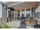 Relaxing covered patio with outdoor seating, a mounted TV, and string lights at 19036 Karyn Ln, Noblesville, IN 46062