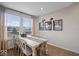 Inviting dining room with natural light, a wooden table, and elegant decor at 19036 Karyn Ln, Noblesville, IN 46062