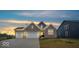 Beautiful brick home with a spacious driveway and an inviting entrance at 19036 Karyn Ln, Noblesville, IN 46062
