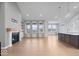 Spacious living room with high ceilings, fireplace, and large windows offering plenty of natural light at 19036 Karyn Ln, Noblesville, IN 46062