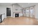 Inviting living room featuring a fireplace and large windows, perfect for relaxation and entertainment at 19036 Karyn Ln, Noblesville, IN 46062
