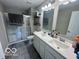 Bright bathroom featuring double sinks, a shower with glass door at 19350 Goins Blvd, Westfield, IN 46074