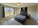 Comfortable bedroom featuring a bed and view from a bright window at 19350 Goins Blvd, Westfield, IN 46074
