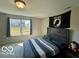 Comfortable bedroom featuring a bed and view from a bright window at 19350 Goins Blvd, Westfield, IN 46074