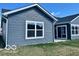 Rear view of a home with sliding glass doors that offer an abundance of natural light and access to the outdoors at 19350 Goins Blvd, Westfield, IN 46074