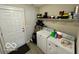 Laundry room with washer, dryer, utility sink and storage shelves at 19350 Goins Blvd, Westfield, IN 46074