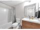 Bathroom featuring a vanity, toilet, bathtub, and neutral tones at 1945 Carrollton Ave, Indianapolis, IN 46202